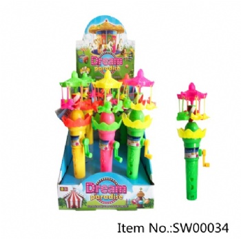 handoperated merry-go-round with light toy candy