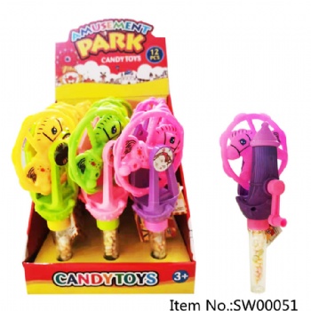 handoperated merry-go-round with light candy toy